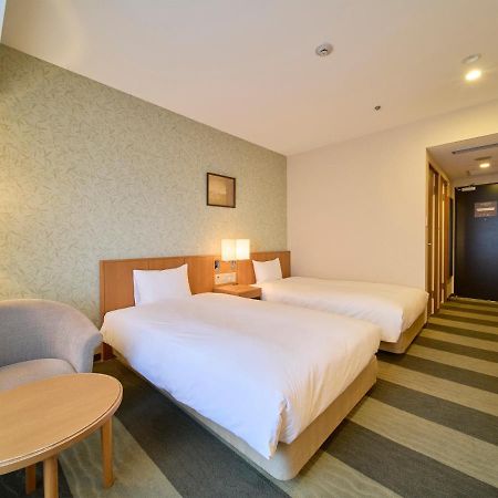 Hotel Granvia Wakayama Esterno foto A room at the hotel