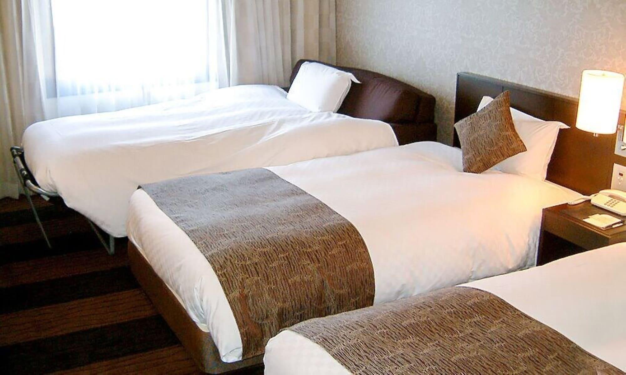 Hotel Granvia Wakayama Esterno foto Beds with bed runners