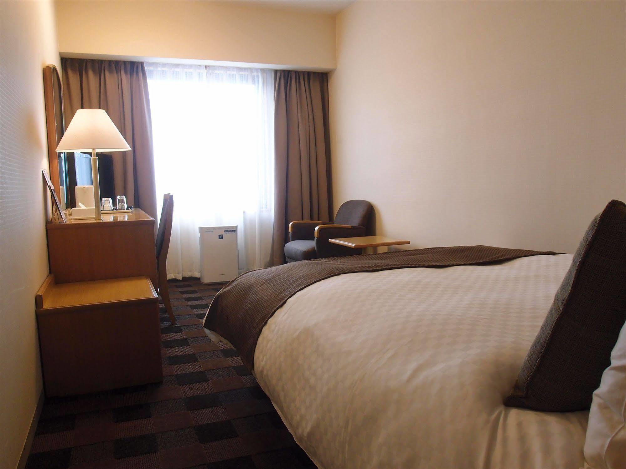 Hotel Granvia Wakayama Esterno foto A room at the hotel